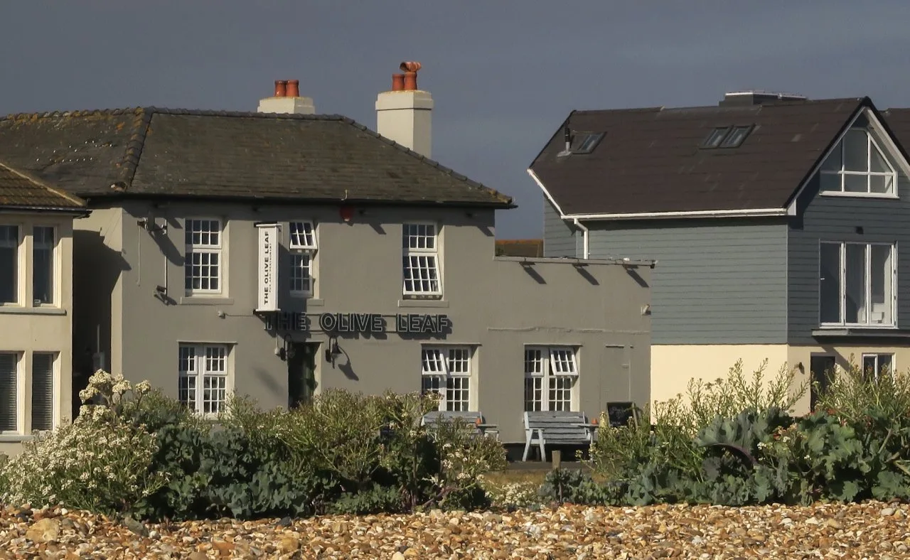 The Olive Leaf seen from the shingle beach at Hayling Island, with sea kale in the foreground