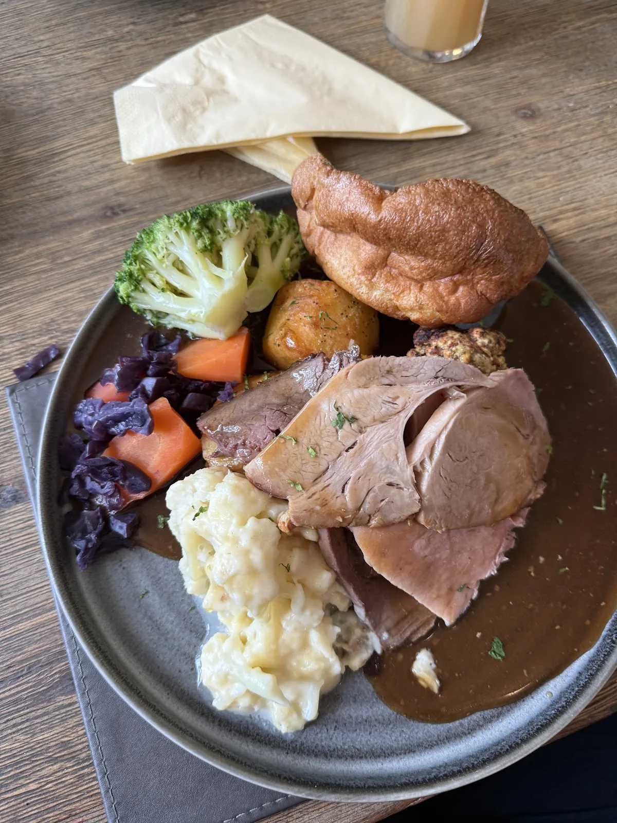 A Sunday roast at The Olive Leaf with a Yorkshire pudding, roast potatoes, cauliflower cheese, red cabbage and gravy